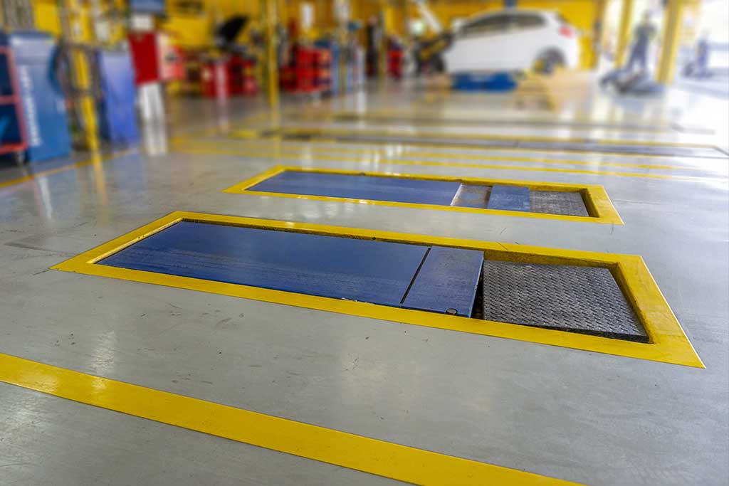 Epoxy flooring system in an auto body garage